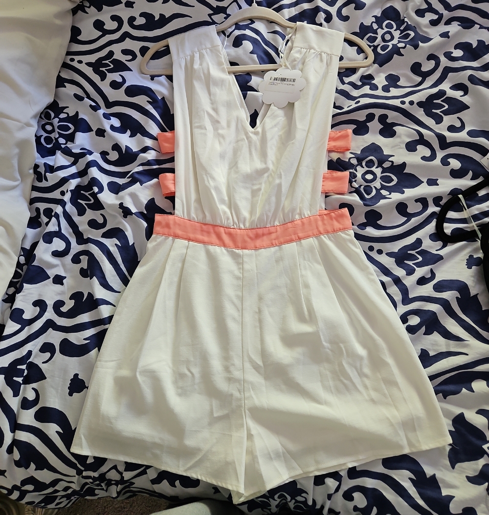 White Sleeveless Romper with Peach Accents